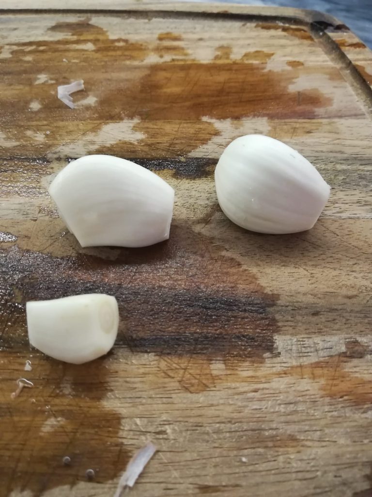 Garlic cloves prepped for slicing