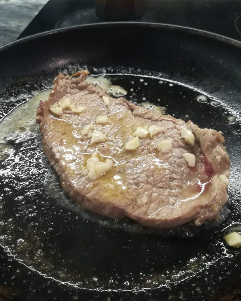 Cooked prego in a pan