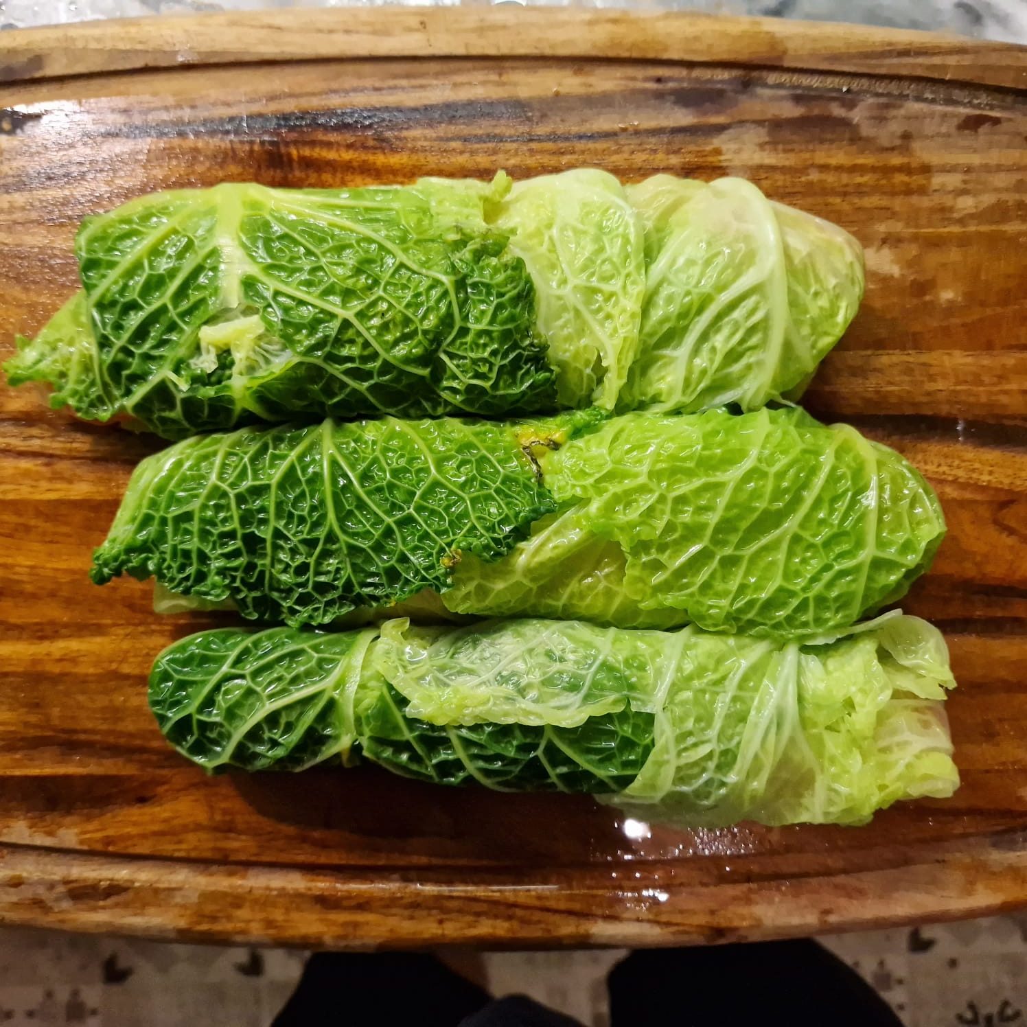 Sausages wrapped in savoy cabbage